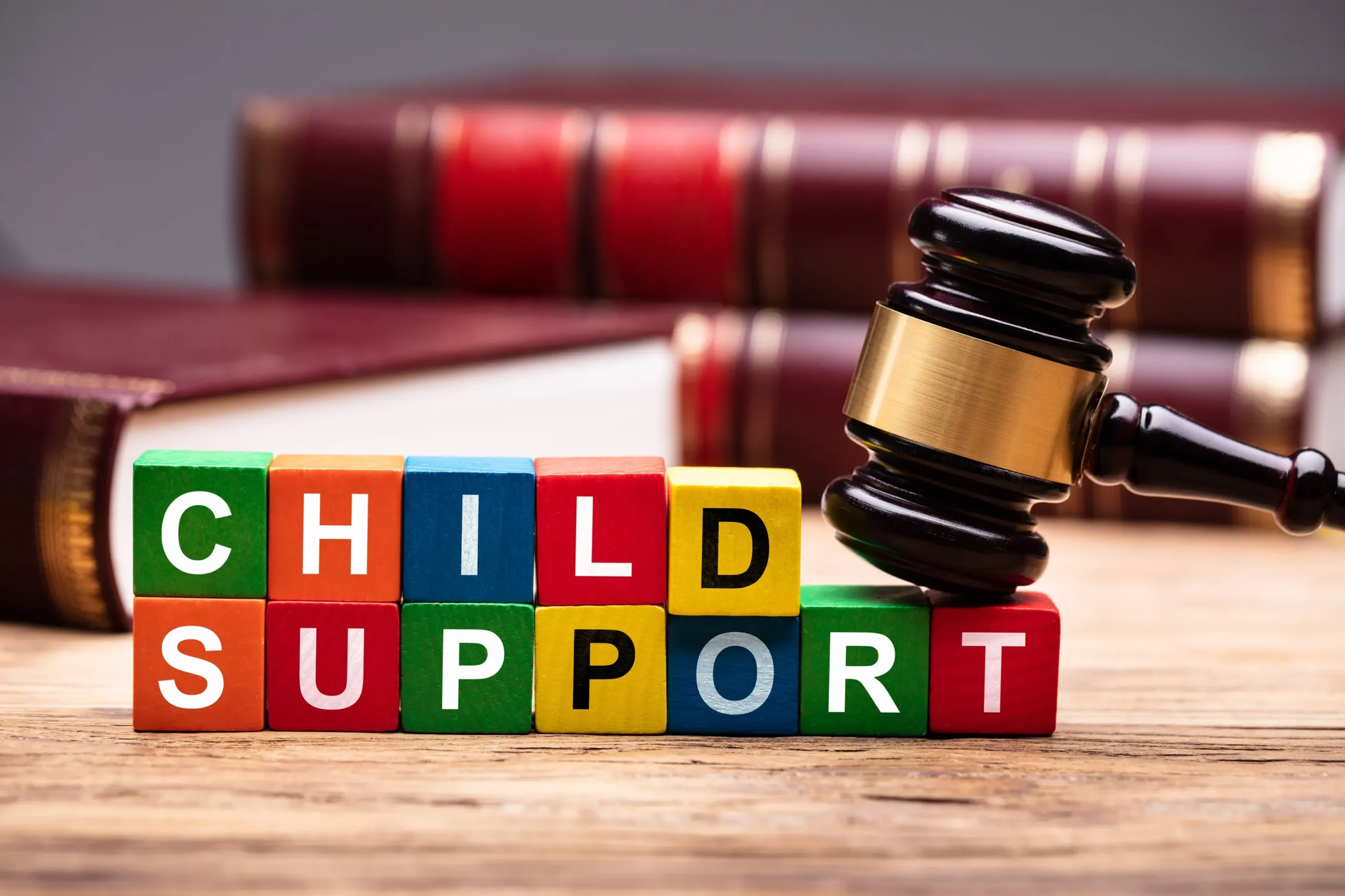 Blocks spelling out child support with a gavel.