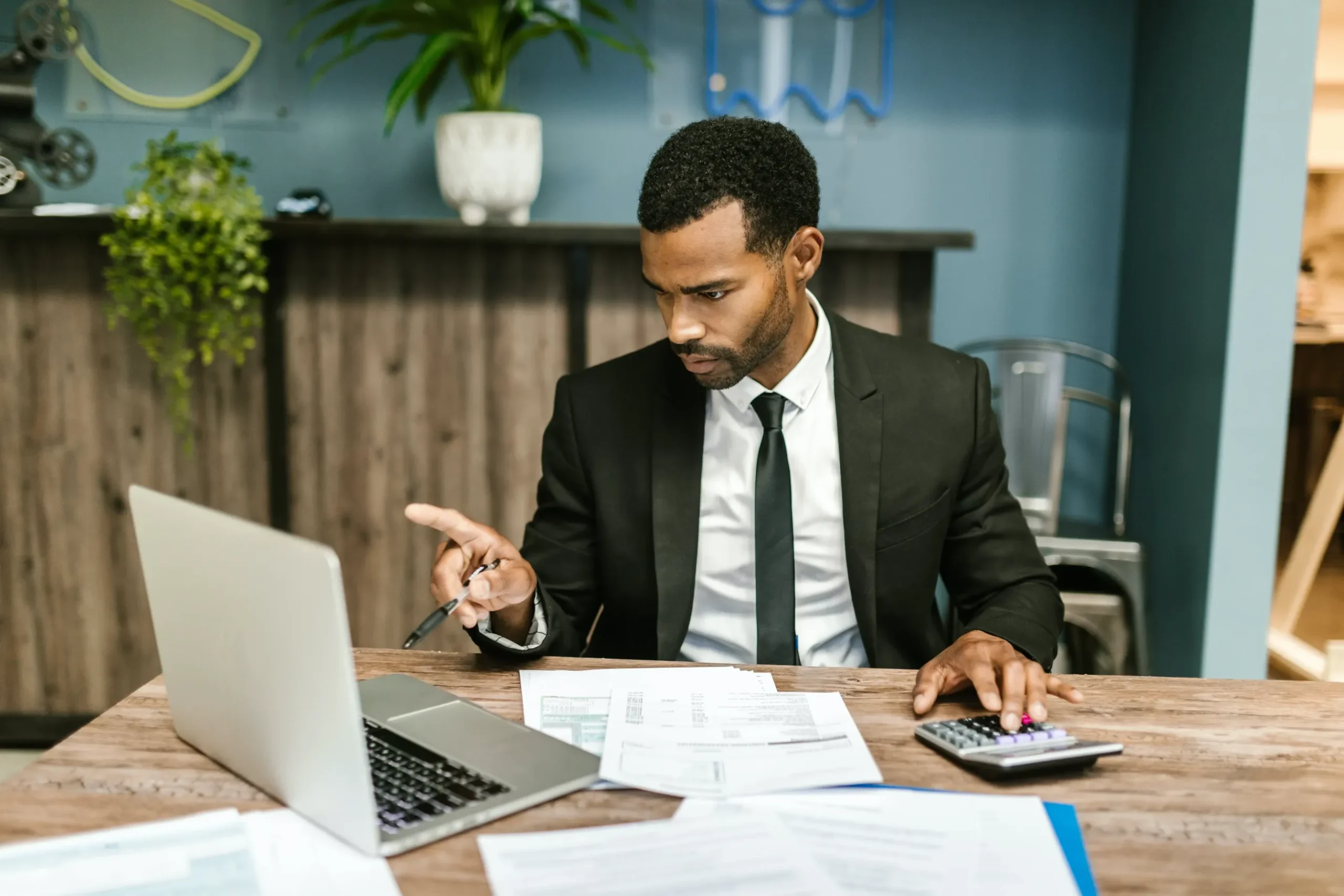 An attorney working at his desk on a his computer.