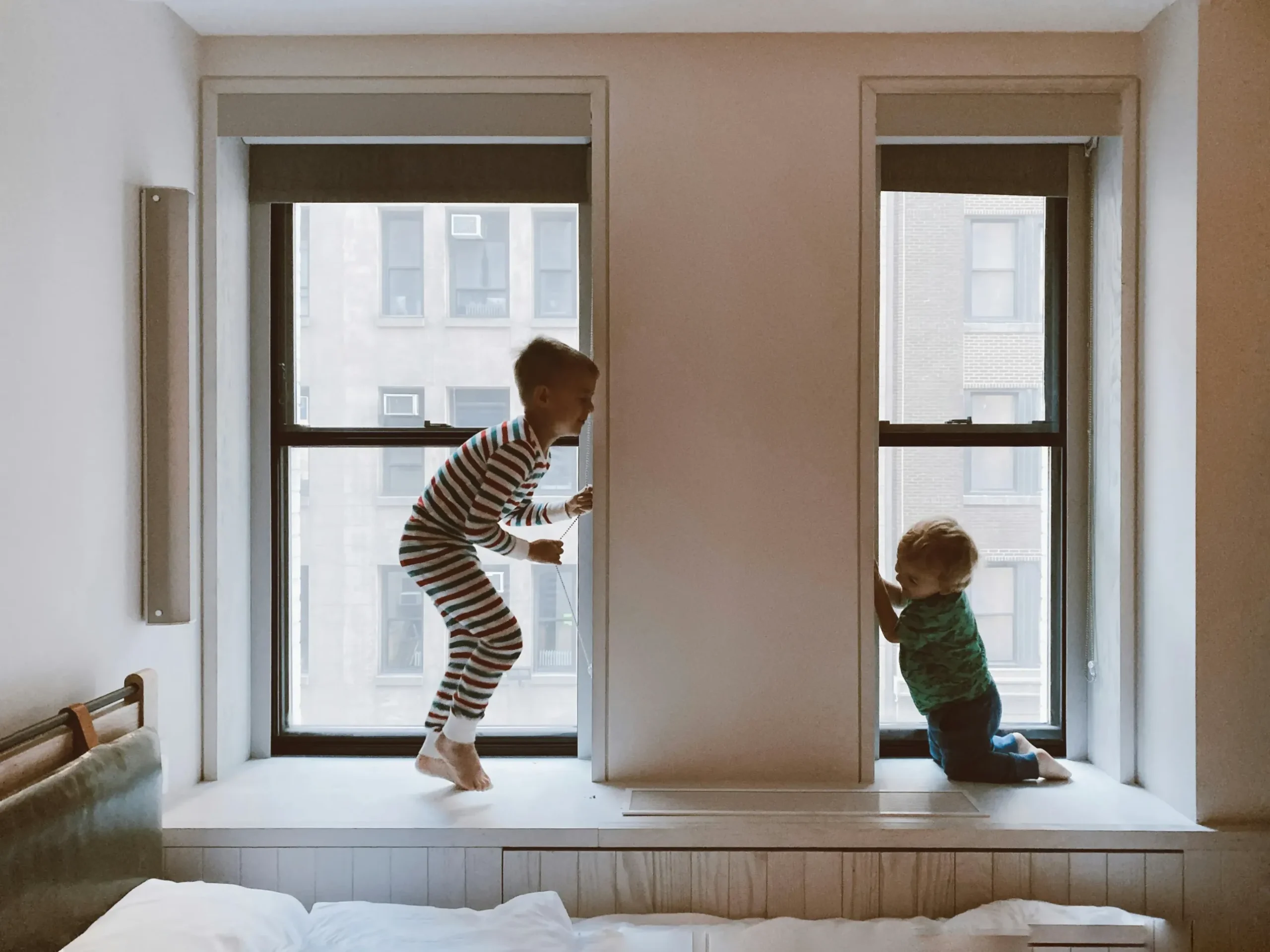Two children playing in their room.