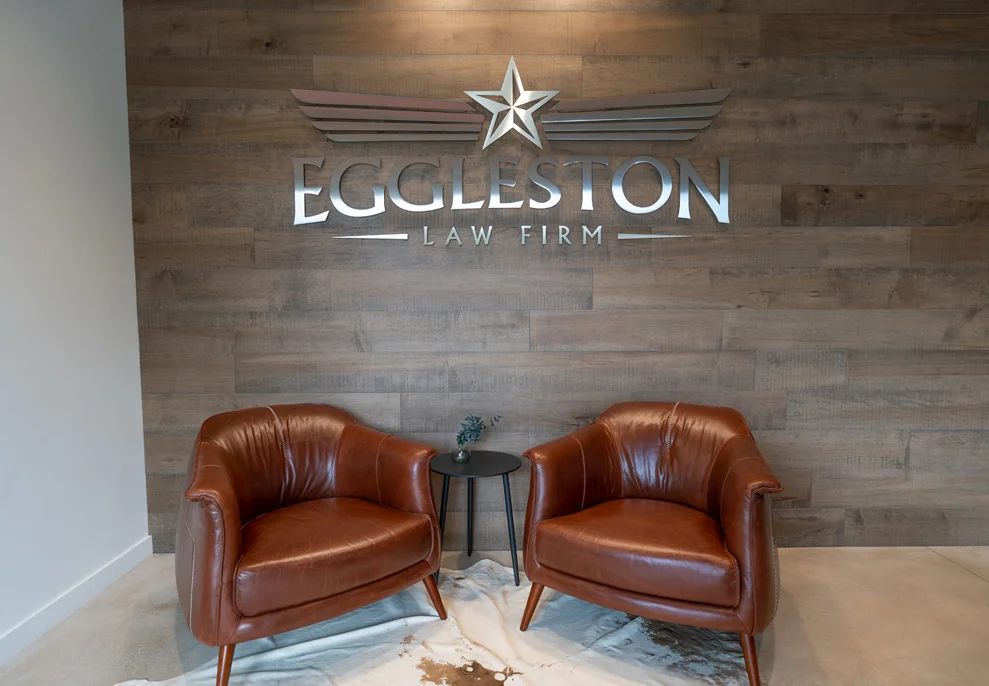 Two brown leather chairs in the lobby of Eggleston Law Firm.