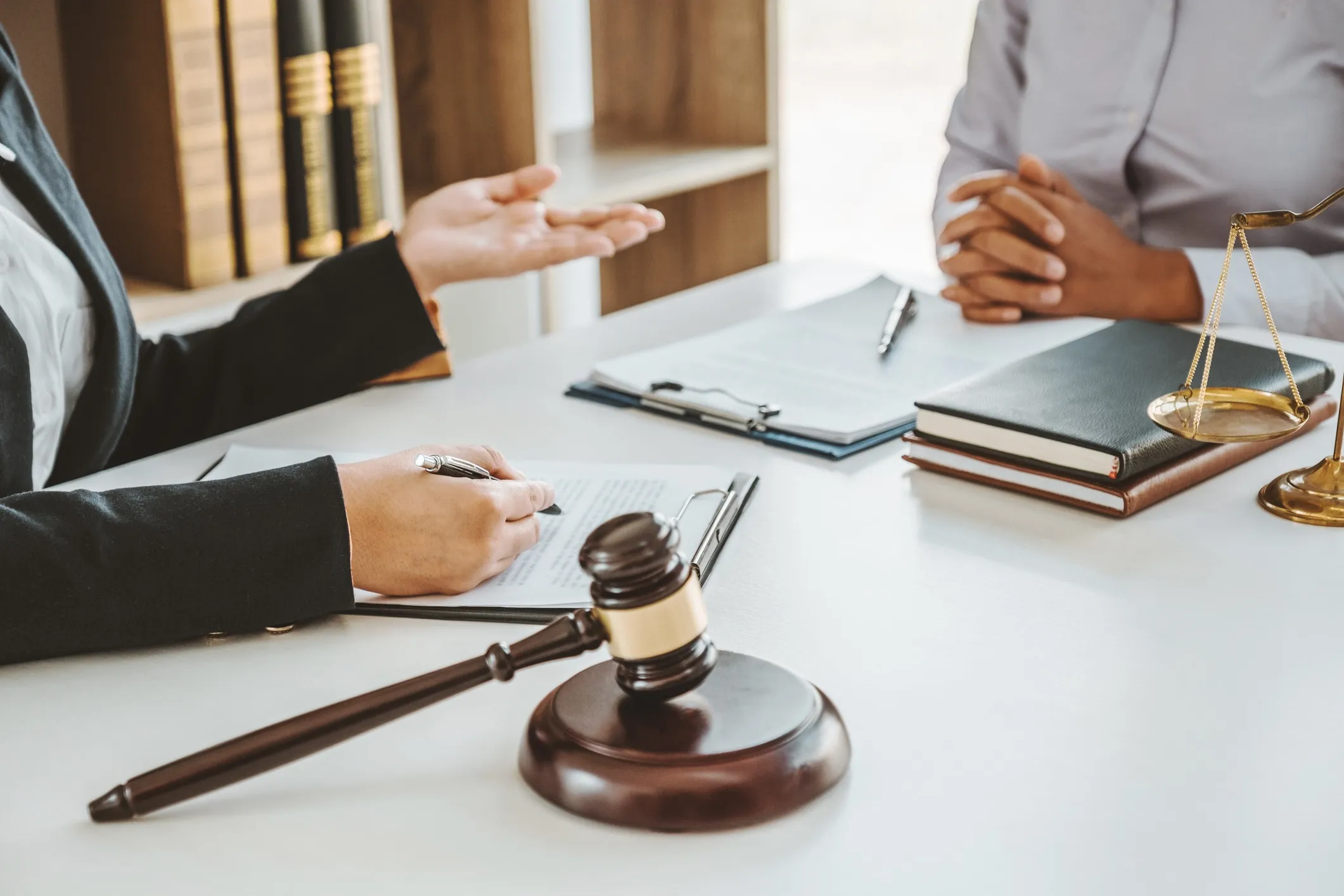 An attorney speaking with their client.