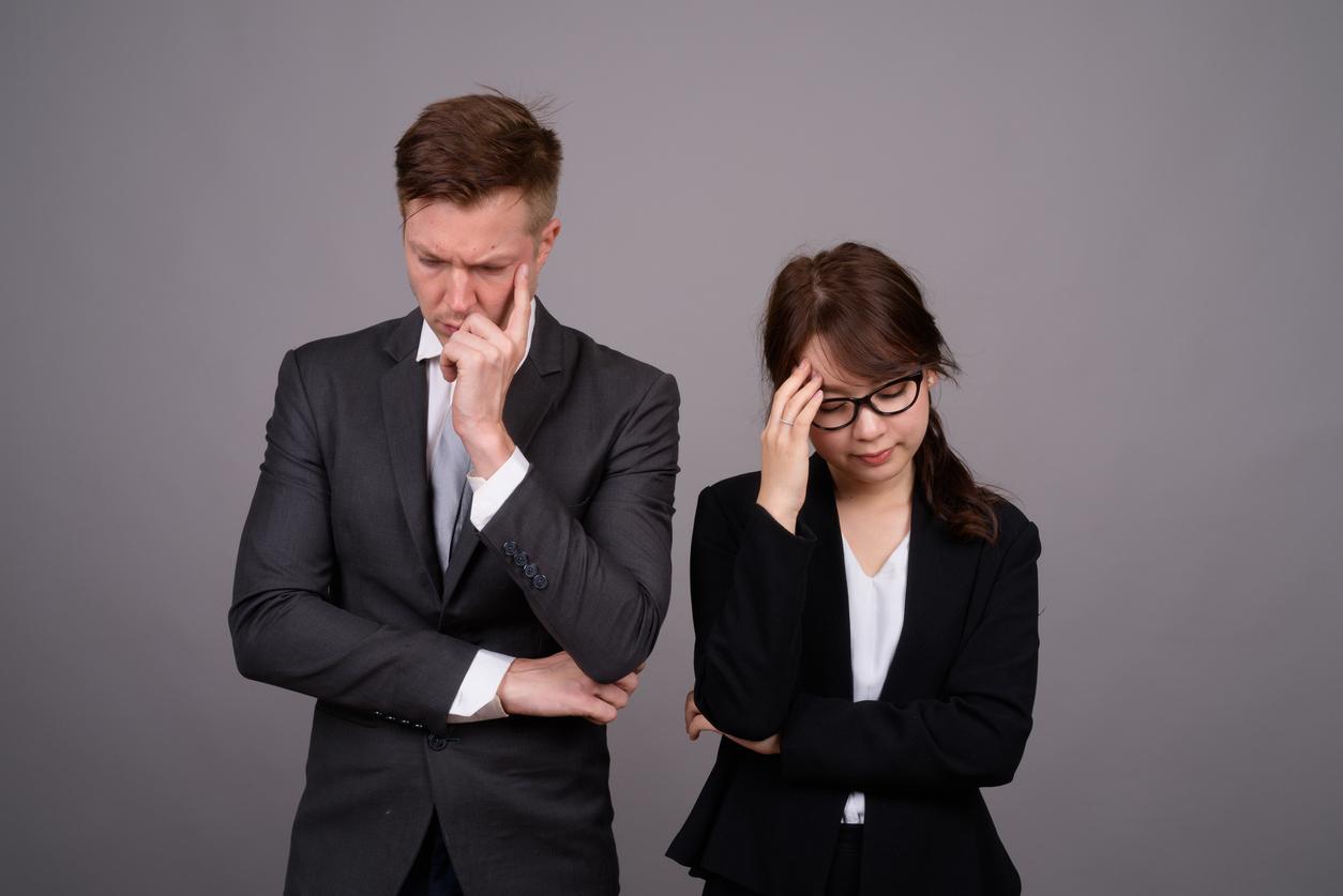 A young professional couple at odds with eachother.