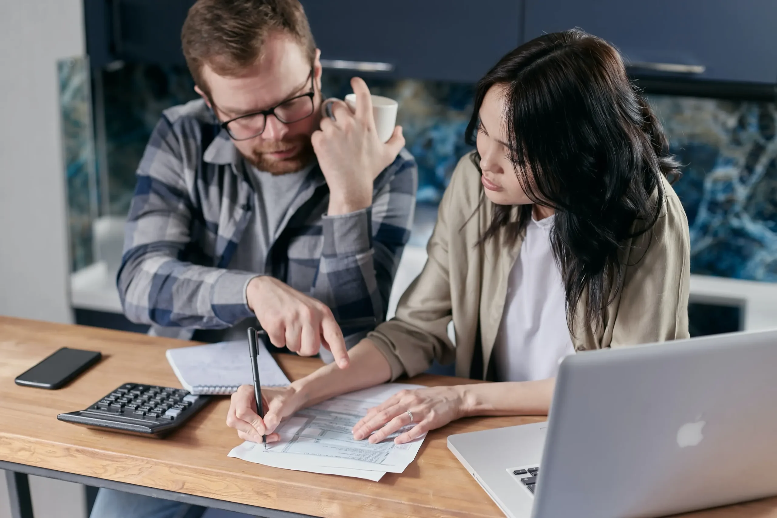 A couple reviewing paperwork together.